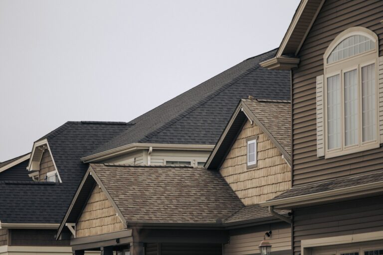 Homes with shingle roofs and siding